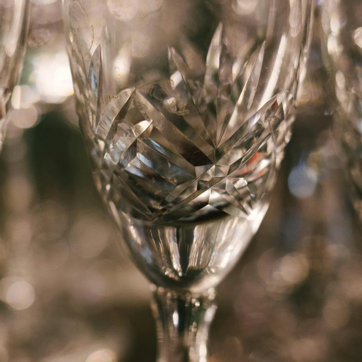 Craftsman hand-cutting crystal facets in Firozabad